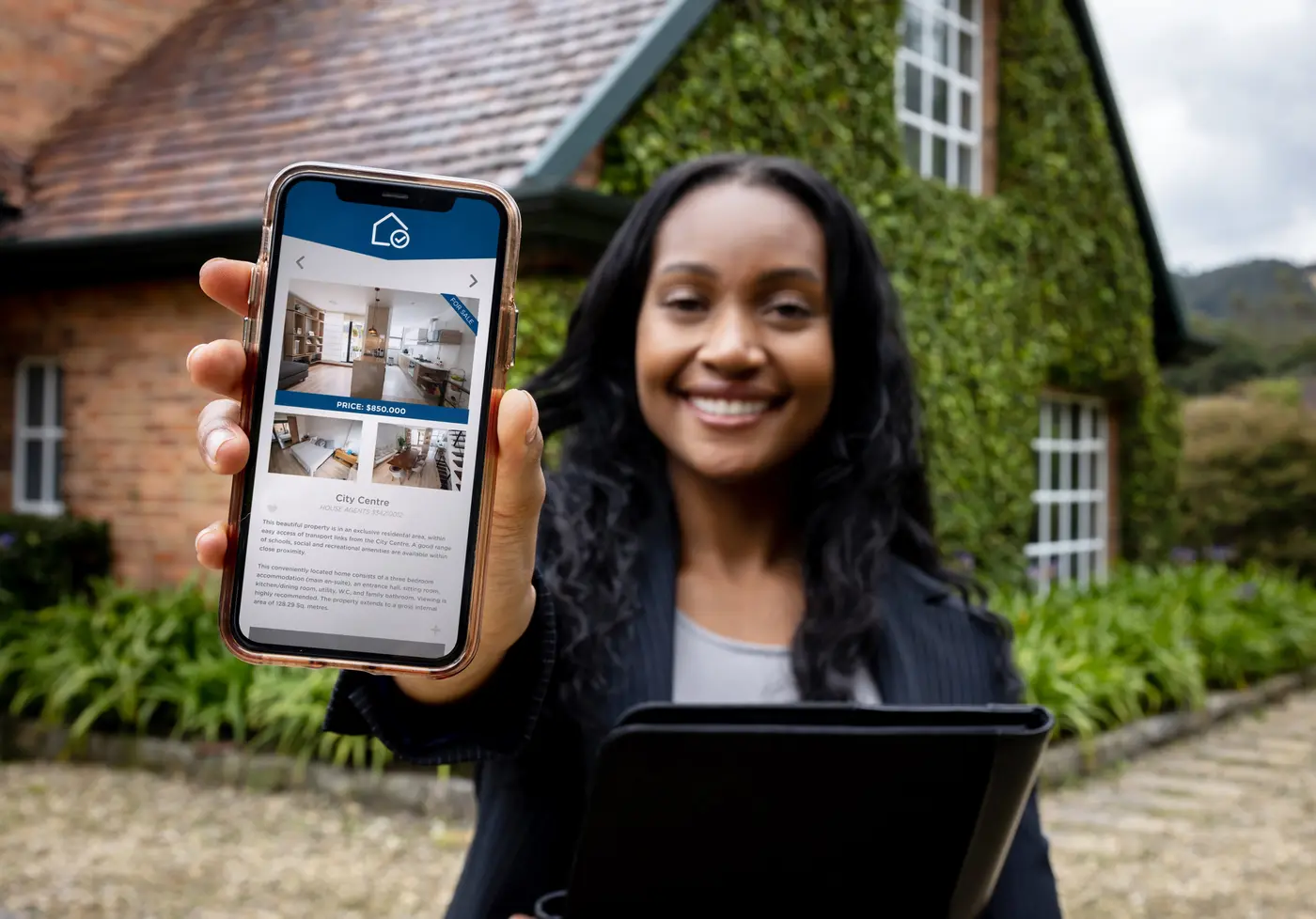 Property manager using a mobile app to list properties. 