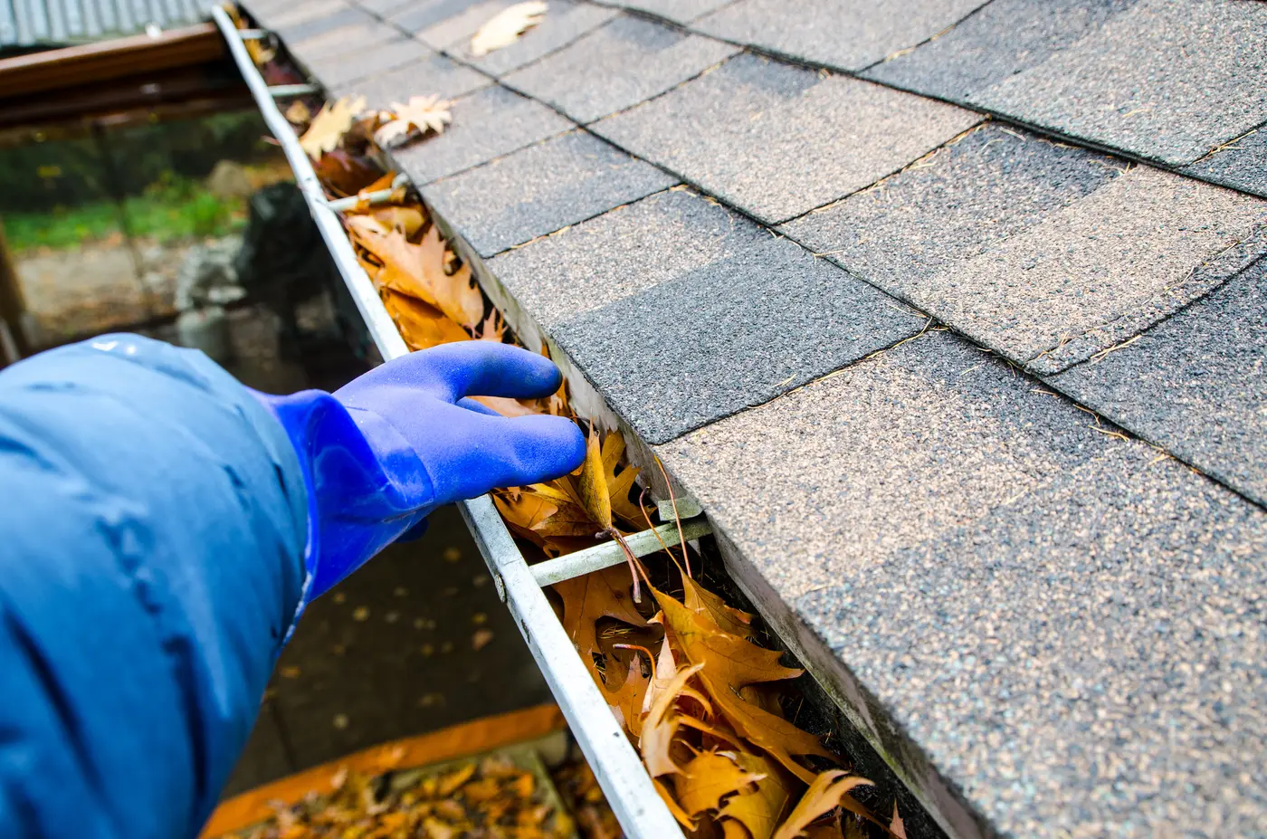 Brandywine Rental Property Owner Cleaning the Gutters for Spring Cleaning