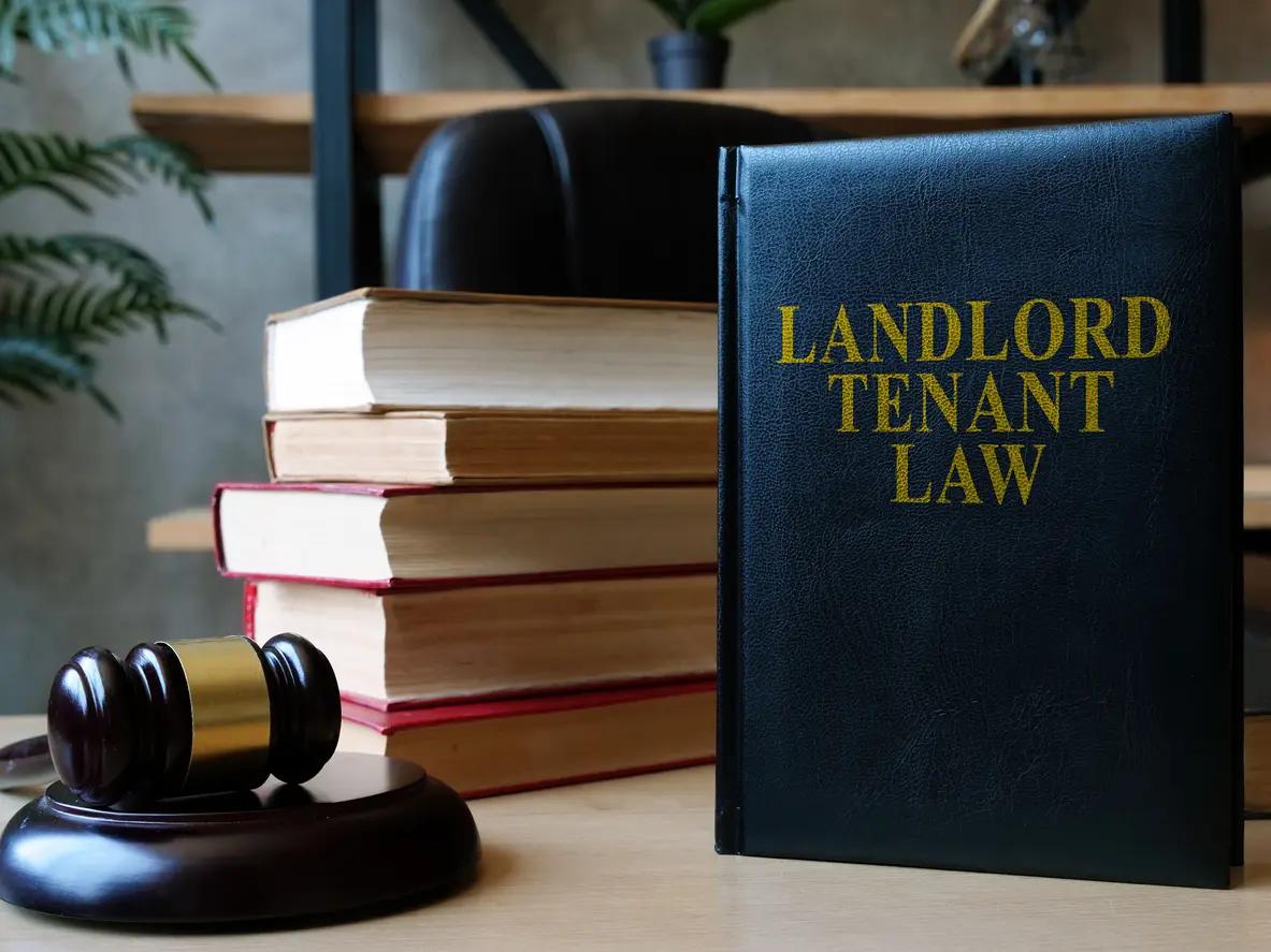 Landlord-Tenant Law Book on a Desk with a Gavel