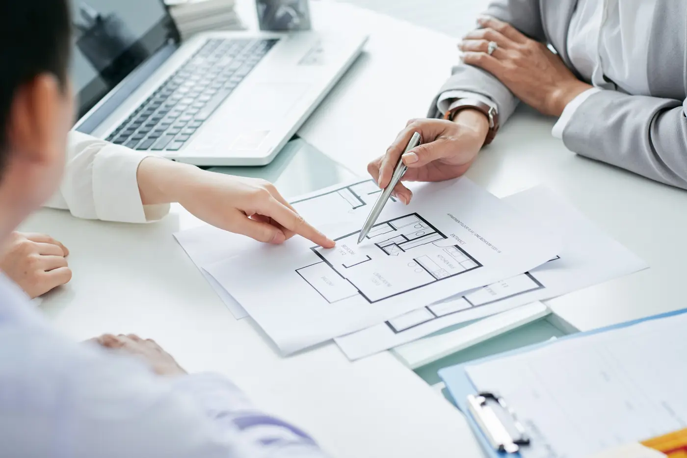 group of people looking at floor plans