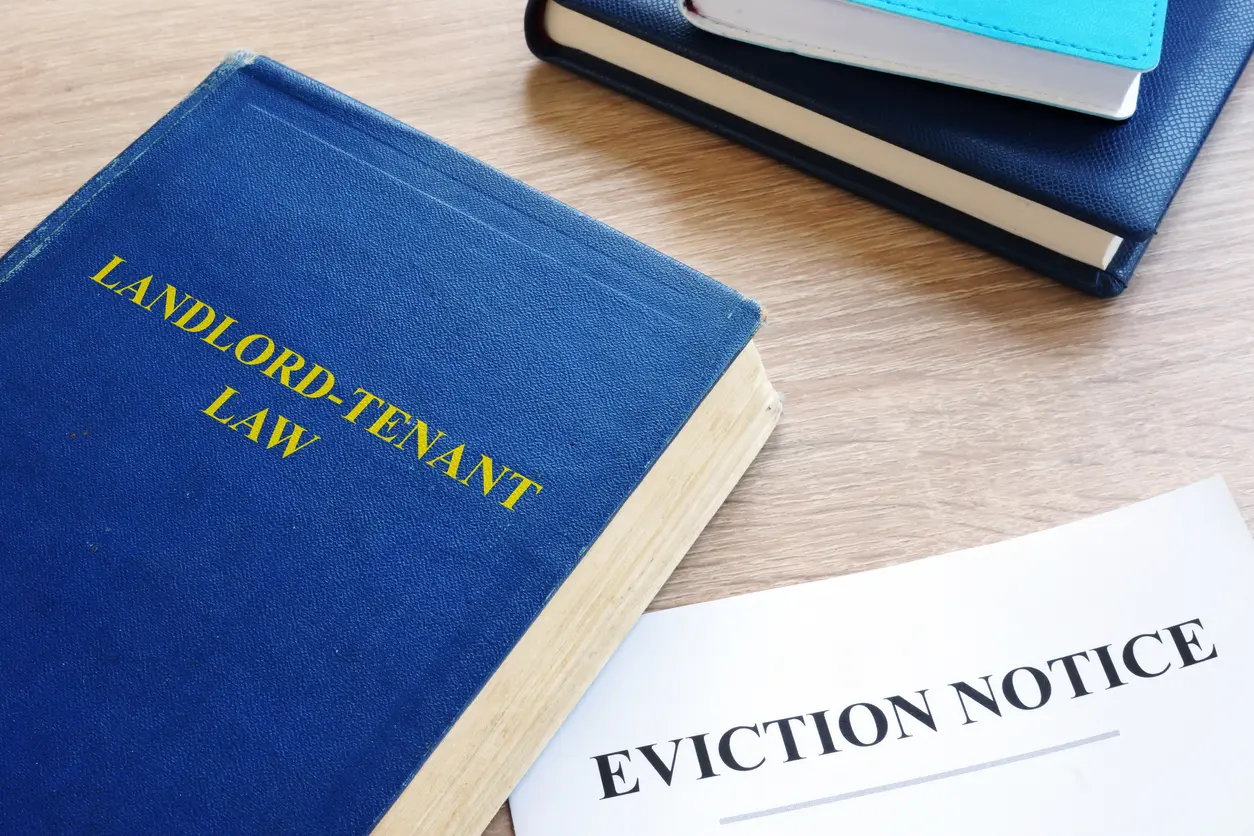 Landlord-Tenant Lawbook Next to an Eviction Notice