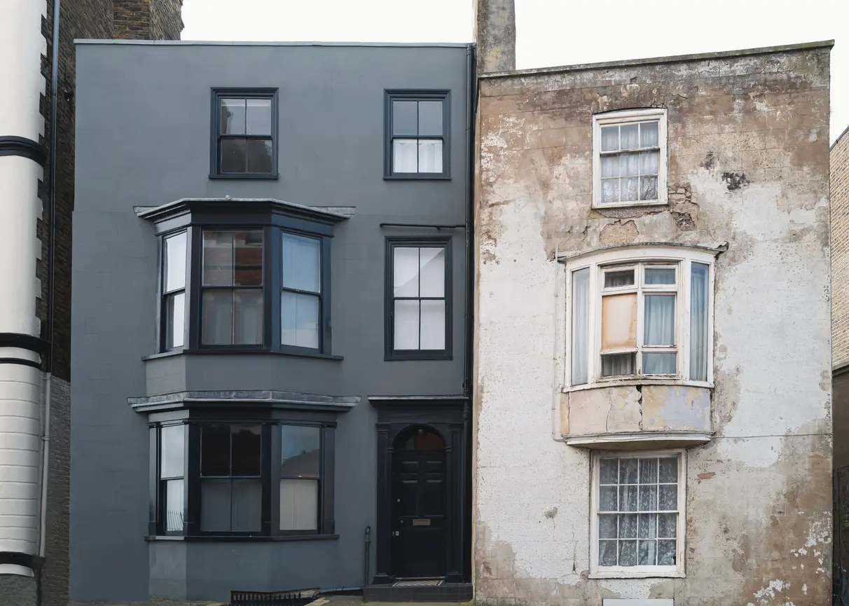 Two Buildings, One Exterior is Renovated and the Other in Disrepair